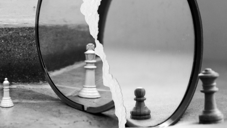 chess pieces in front of mirror